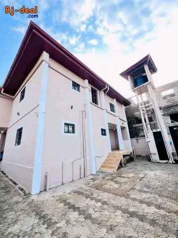 Main image — Beau duplex avec eau chaude forage parking à Massassi Nyom